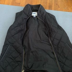Old navy vest worn lightly